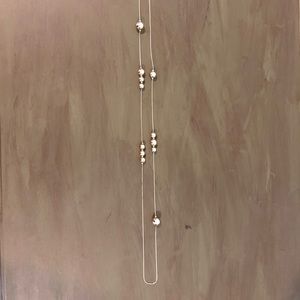 Long gold necklace with beads